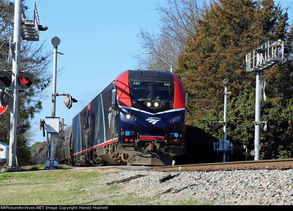 AMTK 332 brings train P092-05 into the station